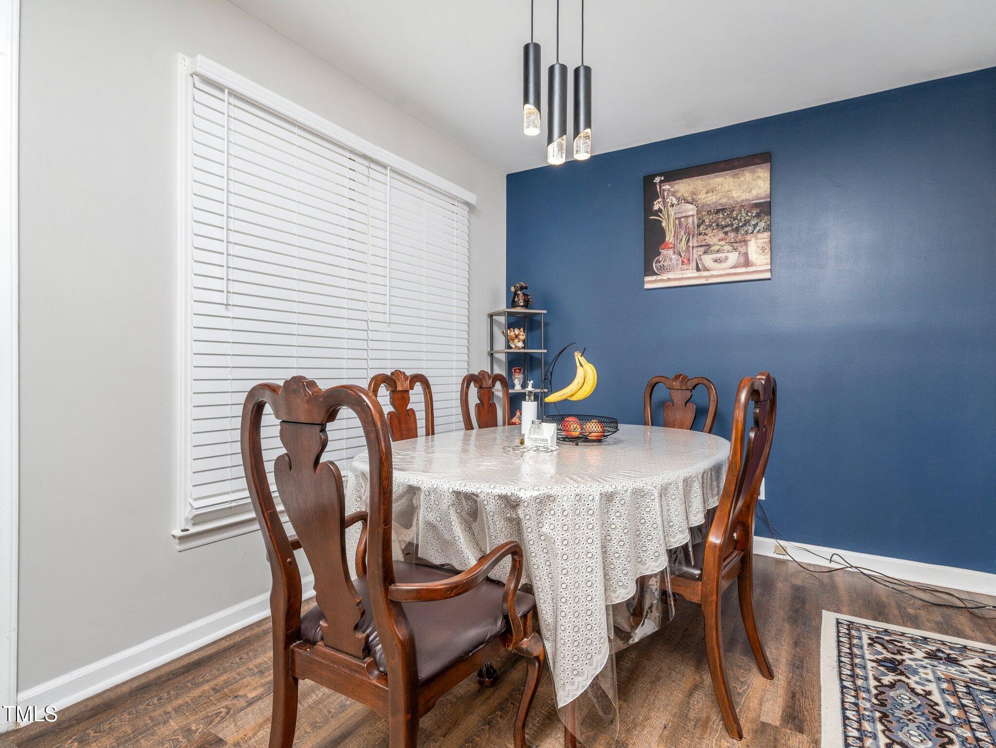 4216 Ferriday Court Raleigh, NC 27616 - Photo 11 of 29 a view of a dining room a table and chairs