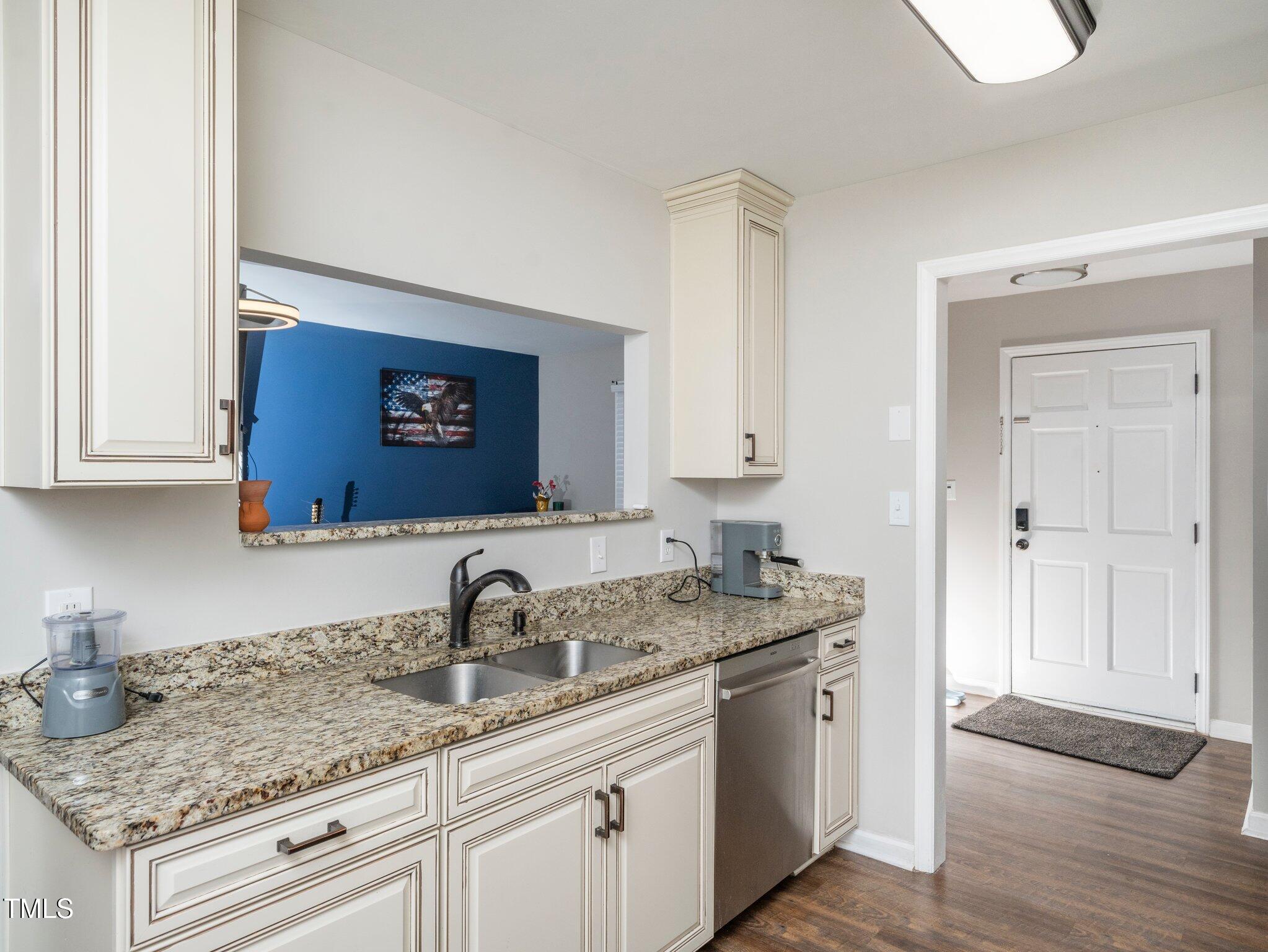 4216 Ferriday Court Raleigh, NC 27616 - Photo 16 of 29 a kitchen with a sink and cabinets