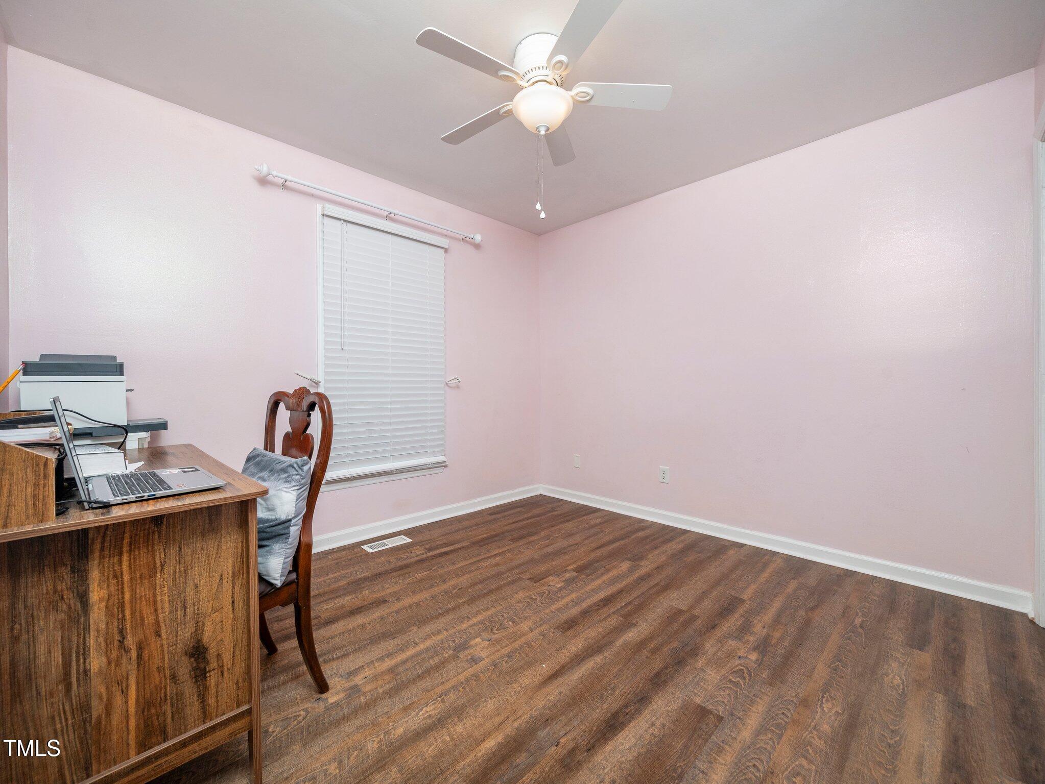 4216 Ferriday Court Raleigh, NC 27616 - Photo 18 of 29 a workspace with furniture and wooden floor