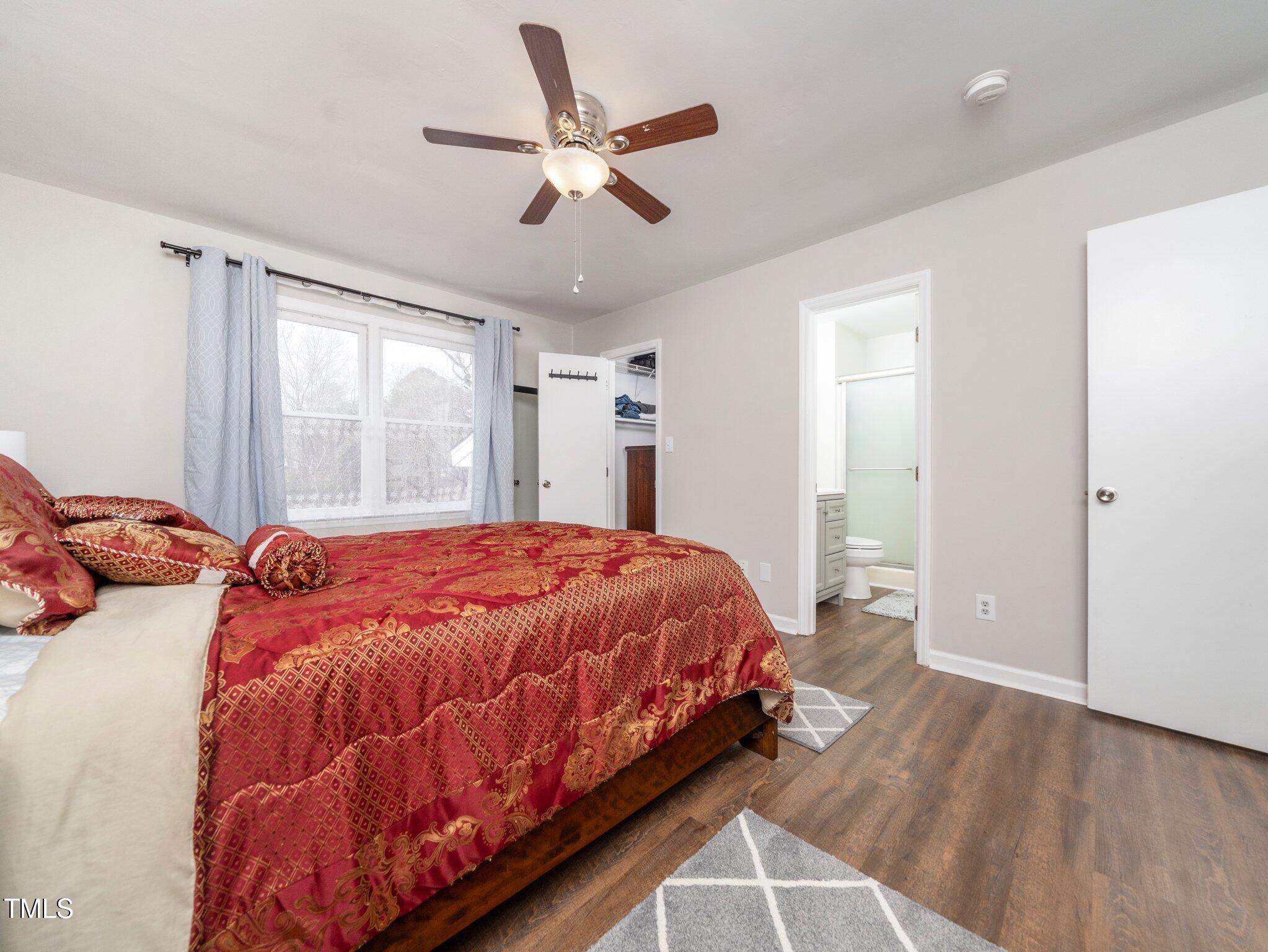 4216 Ferriday Court Raleigh, NC 27616 - Photo 24 of 29 a bed sitting in a bedroom next to a window