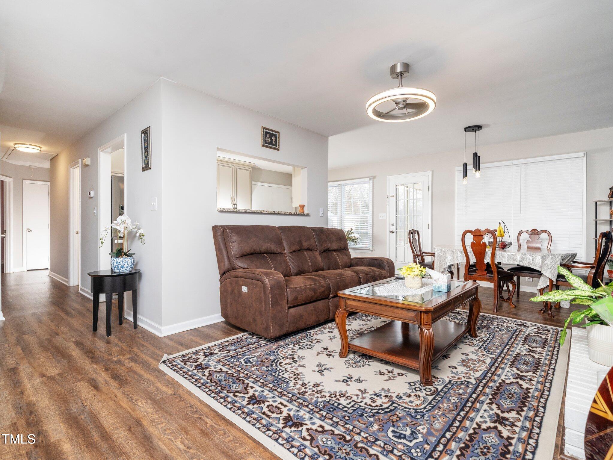 4216 Ferriday Court Raleigh, NC 27616 - Photo 5 of 29 a living room with furniture and a table