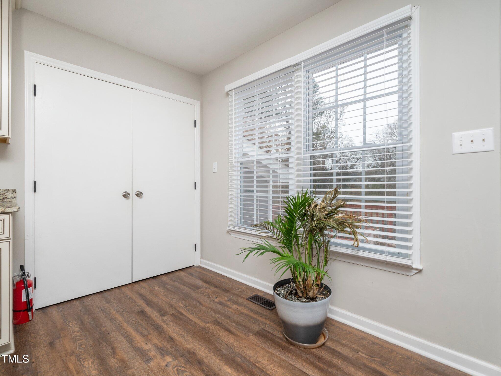 4216 Ferriday Court Raleigh, NC 27616 - Photo 8 of 29 a view of an entryway with wooden floor