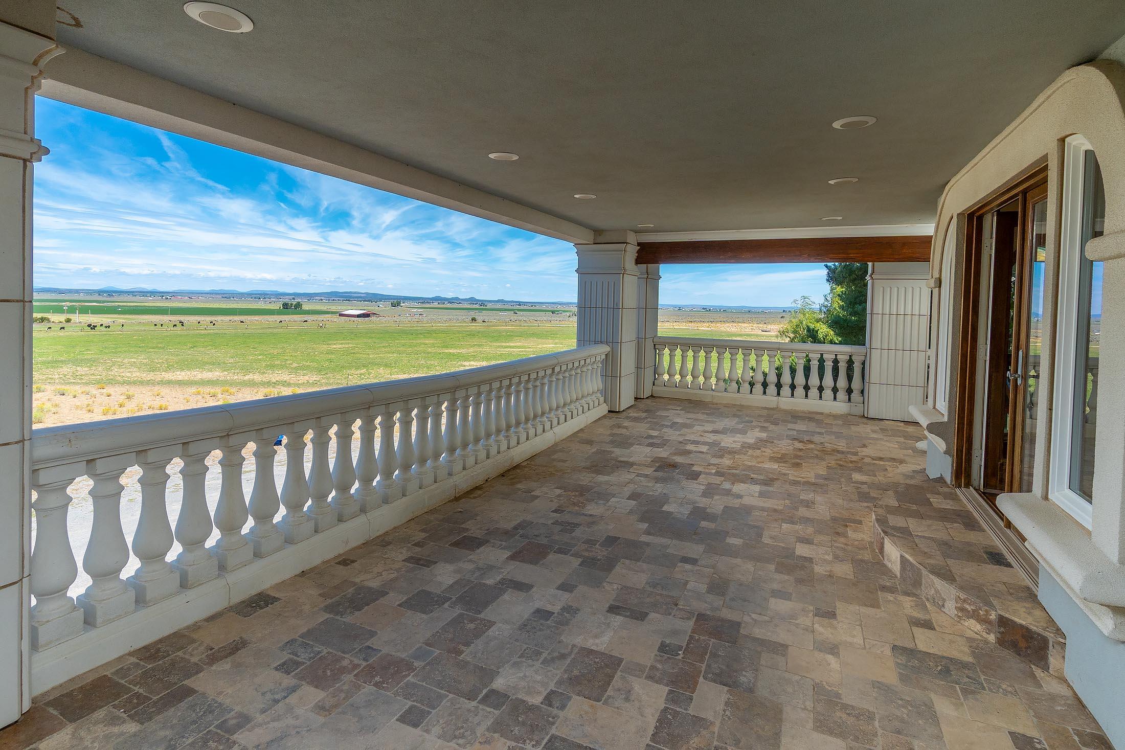59047 Old Lake Road Christmas Valley, OR 97641 - Photo 24 of 55 Large third floor balcony overlooking the pasture and surrounding farm land