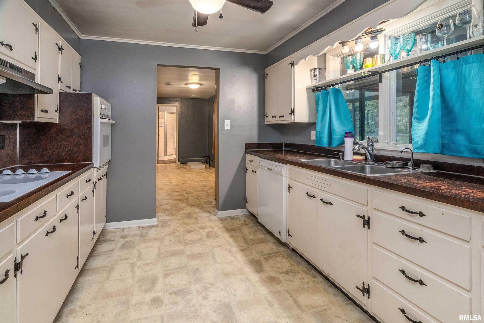 170 Melody Lane Murphysboro, IL 62966 - Photo 15 of 42 a large kitchen with granite countertop a sink and cabinets