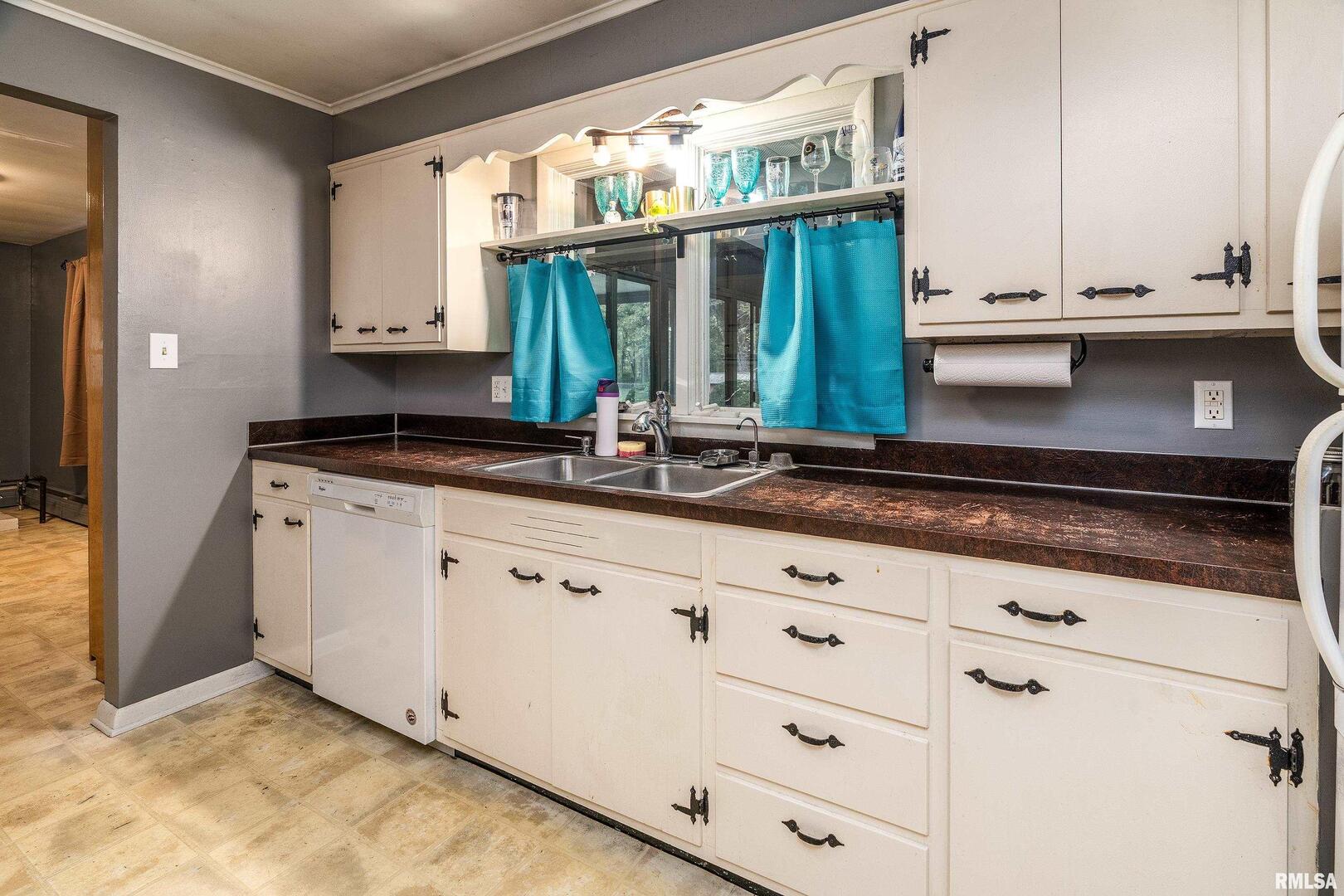 170 Melody Lane Murphysboro, IL 62966 - Photo 16 of 42 a kitchen with white cabinets and a window