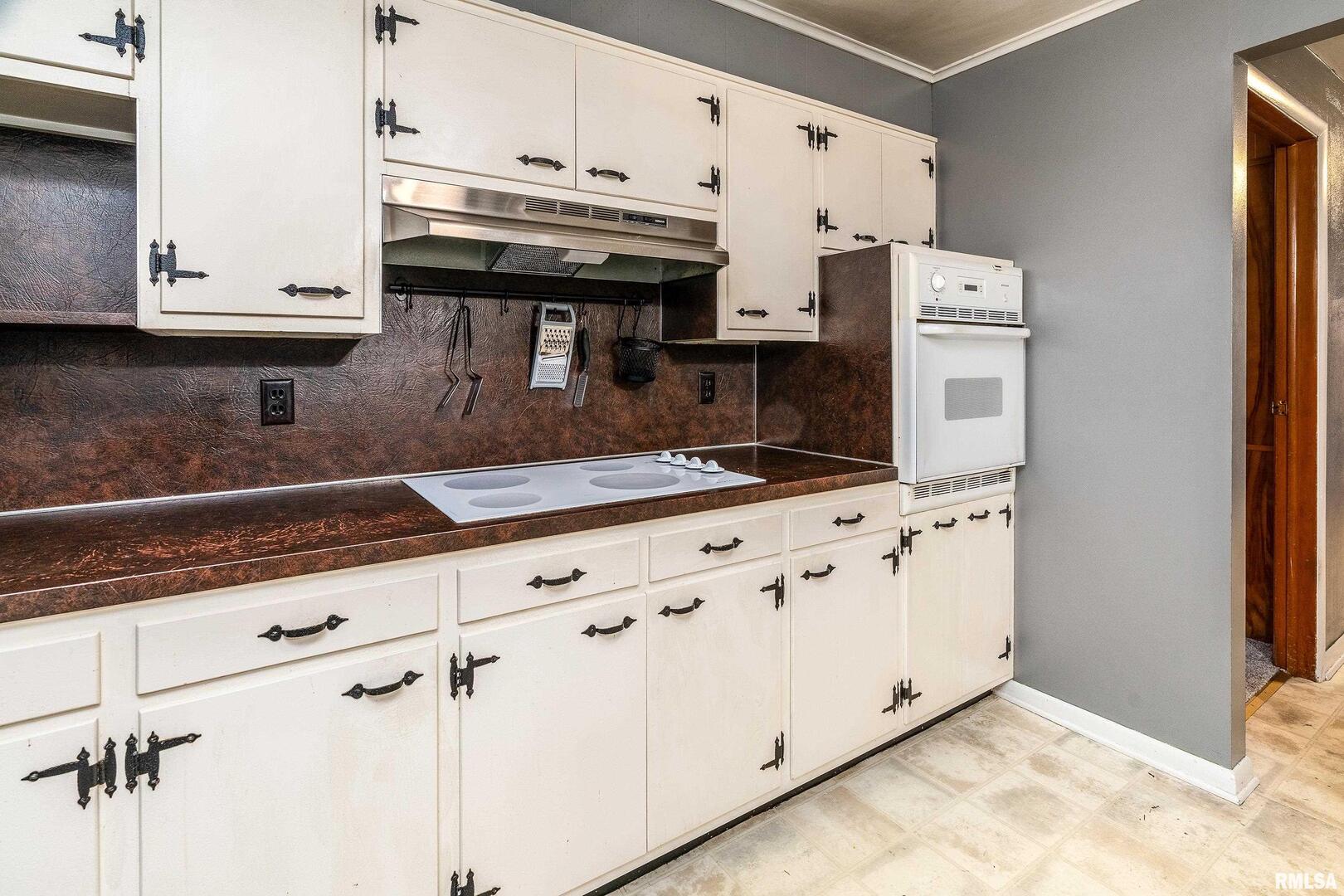 170 Melody Lane Murphysboro, IL 62966 - Photo 17 of 42 a kitchen with stainless steel appliances granite countertop a sink a stove and a microwave