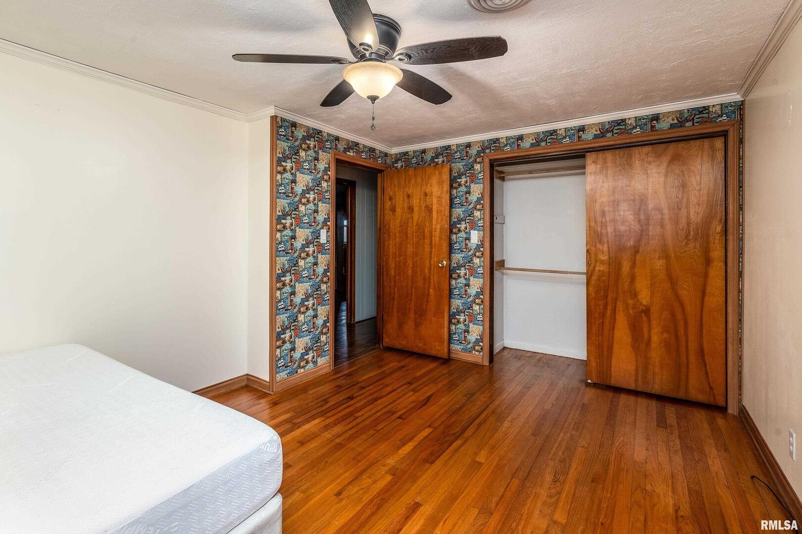 170 Melody Lane Murphysboro, IL 62966 - Photo 23 of 42 a bedroom with a bed and a chandelier