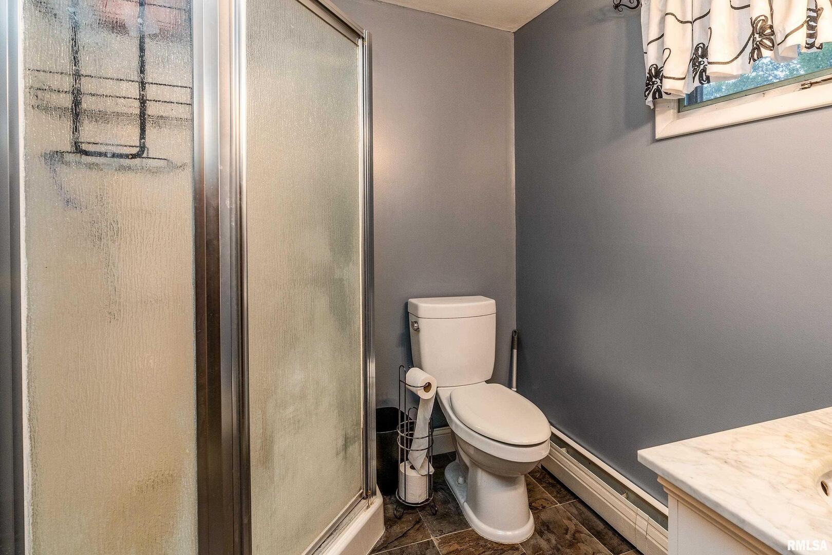 170 Melody Lane Murphysboro, IL 62966 - Photo 26 of 42 a white toilet sitting next to a shower