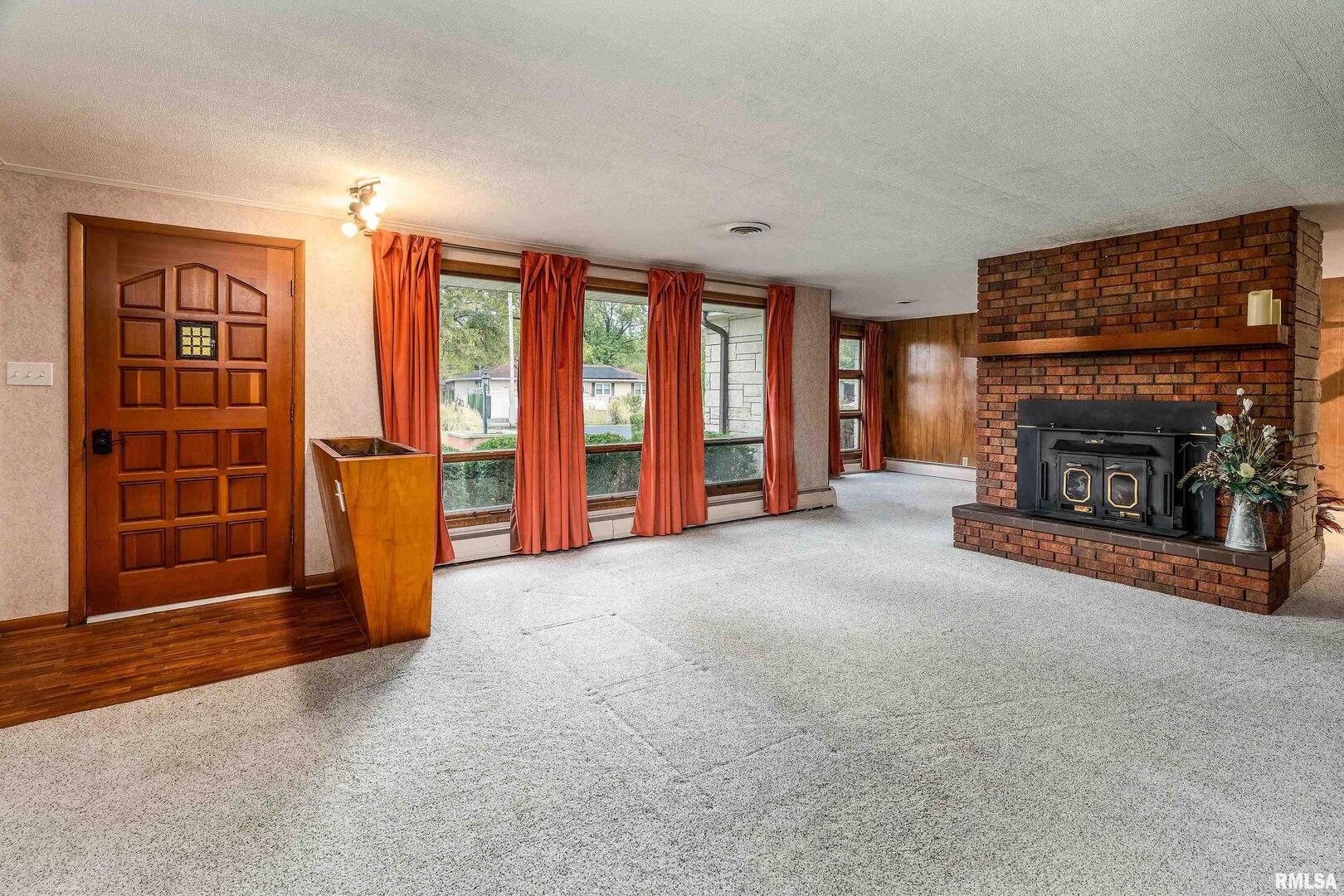 170 Melody Lane Murphysboro, IL 62966 - Photo 5 of 42 a view of an empty room with furniture and a fireplace
