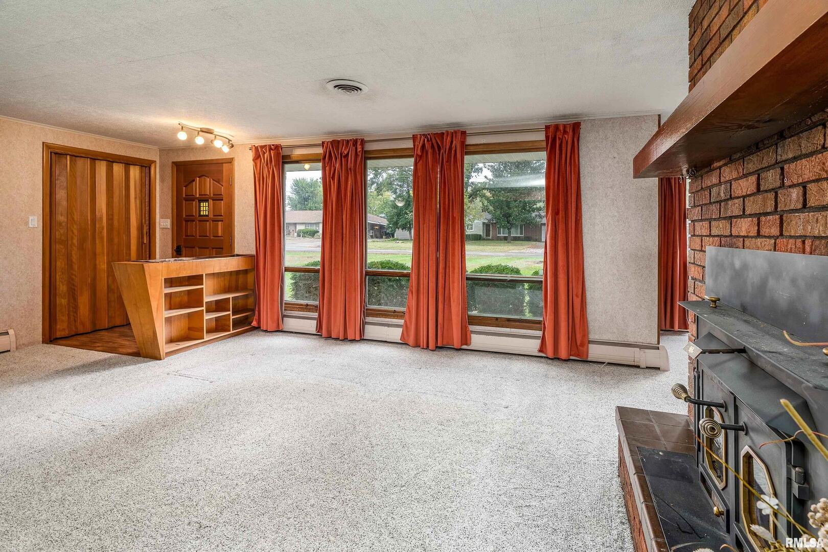 170 Melody Lane Murphysboro, IL 62966 - Photo 8 of 42 an empty room with furniture and windows