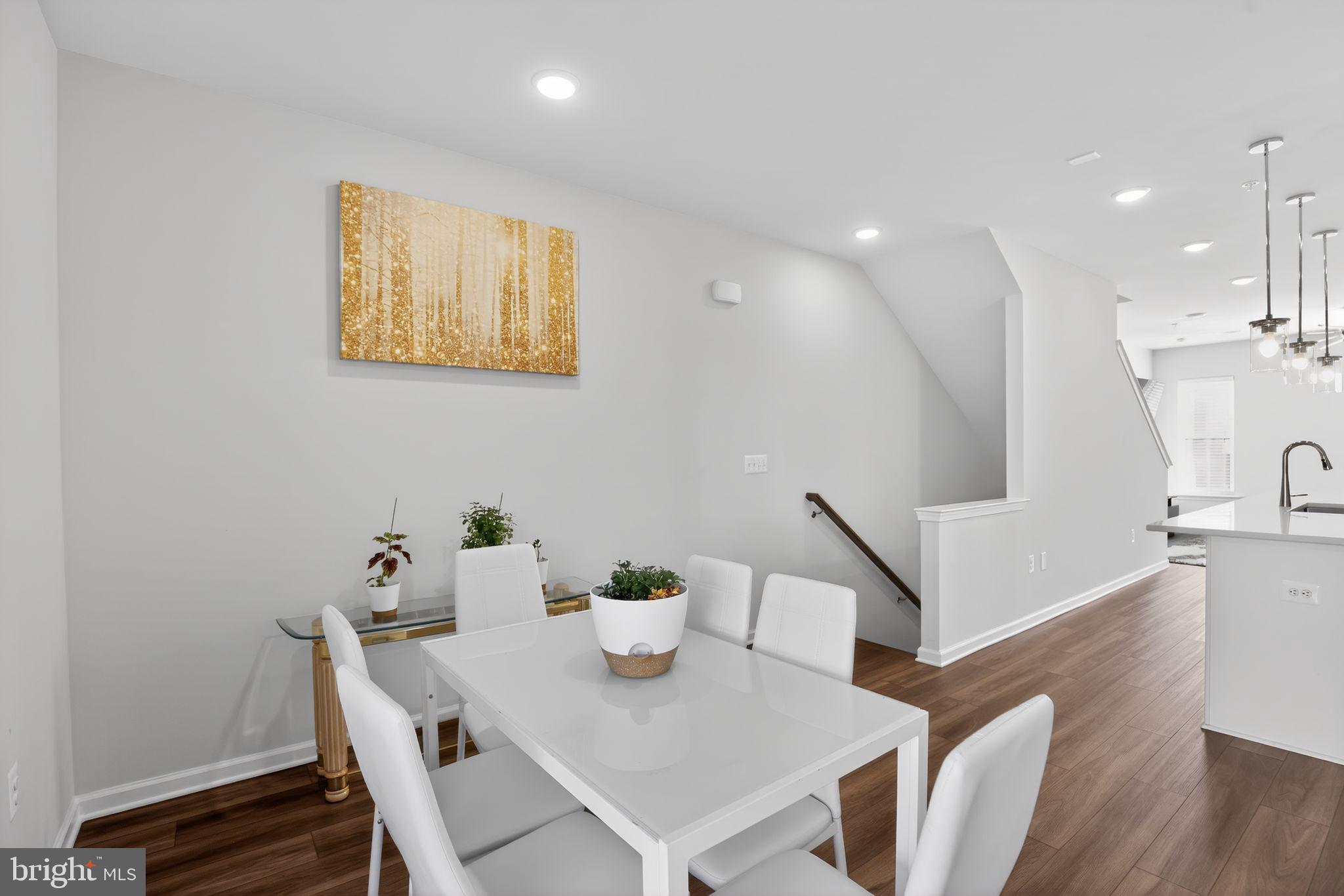 299 Freshet Lane Laurel, MD 20724 - Photo 11 of 33 a view of a dining room with furniture and wooden floor