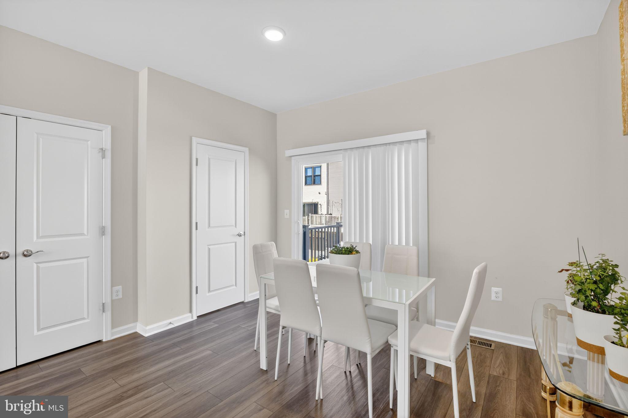 299 Freshet Lane Laurel, MD 20724 - Photo 12 of 33 a view of a dining room with furniture and wooden floor