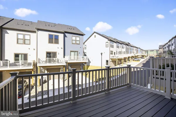 a view of a house with wooden deck
