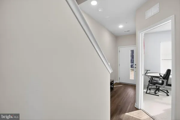 a view of entryway with livingroom and wooden floor