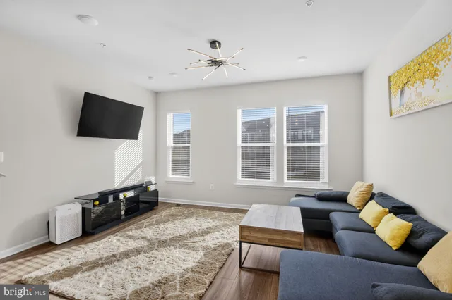 a livingroom with a workspace