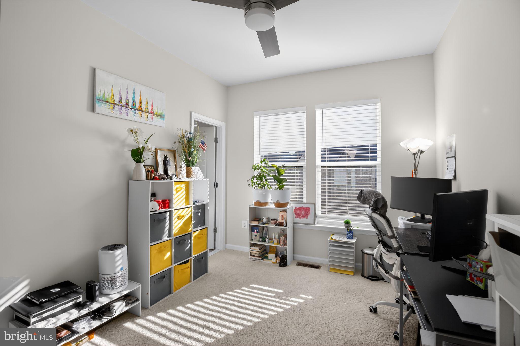 299 Freshet Lane Laurel, MD 20724 - Photo 28 of 33 a view of a workspace with furniture and a window