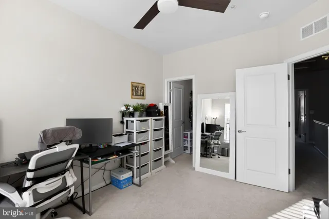 a view of a workspace with furniture