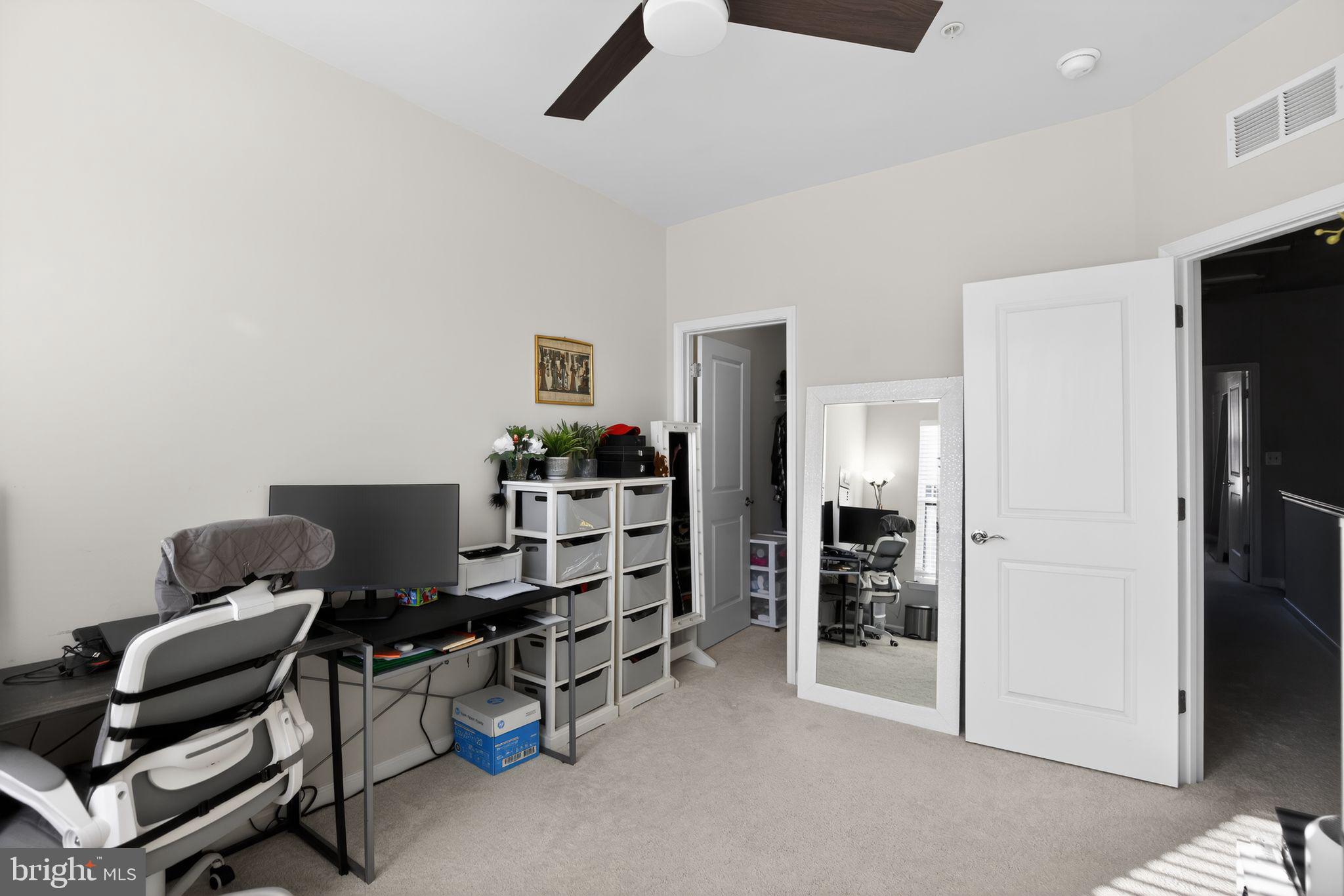 299 Freshet Lane Laurel, MD 20724 - Photo 29 of 33 a room with furniture a ceiling fan and a window