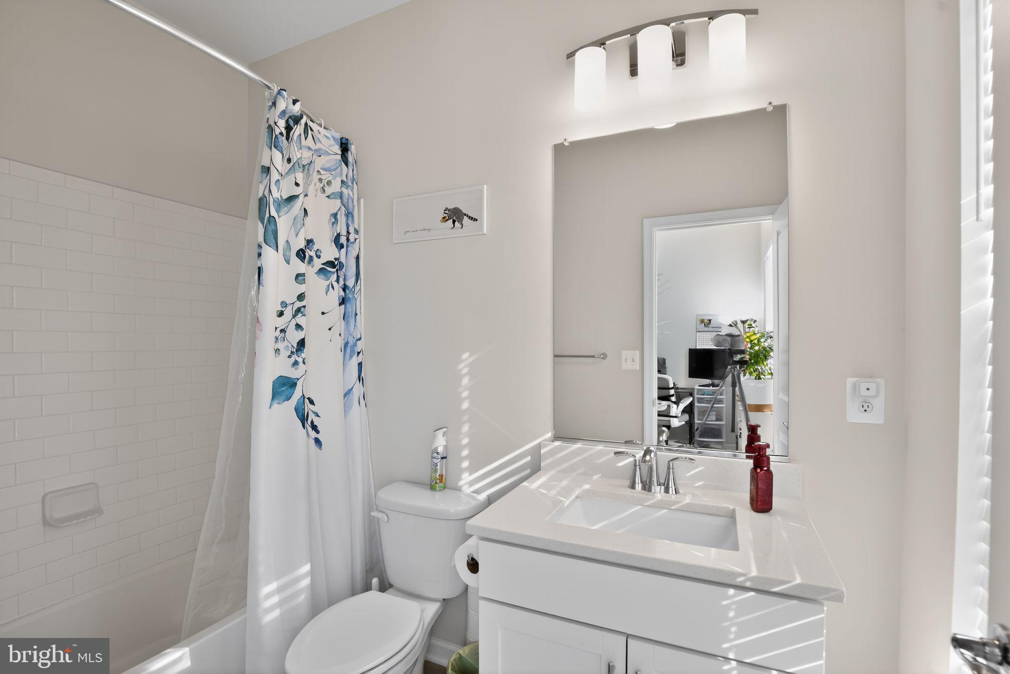 299 Freshet Lane Laurel, MD 20724 - Photo 3 of 33 a bathroom with a sink toilet and shower