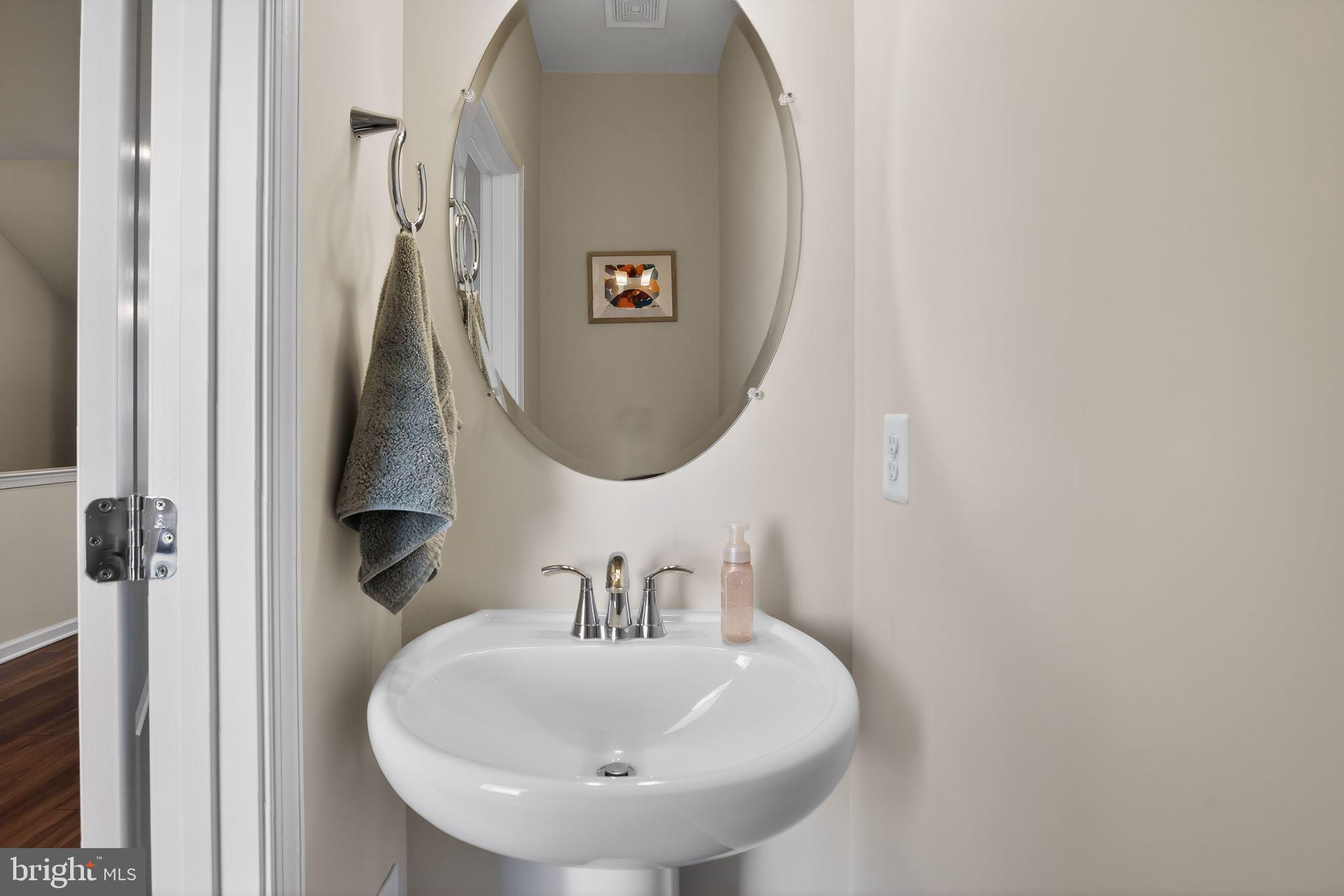 299 Freshet Lane Laurel, MD 20724 - Photo 7 of 33 a bathroom with a sink and a mirror