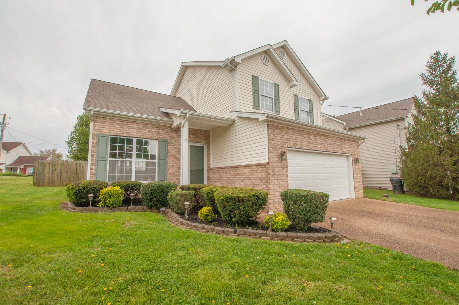 1556 Stone Hill Road Mount Juliet, TN 37122 - Photo 2 of 22 a front view of a house with garden