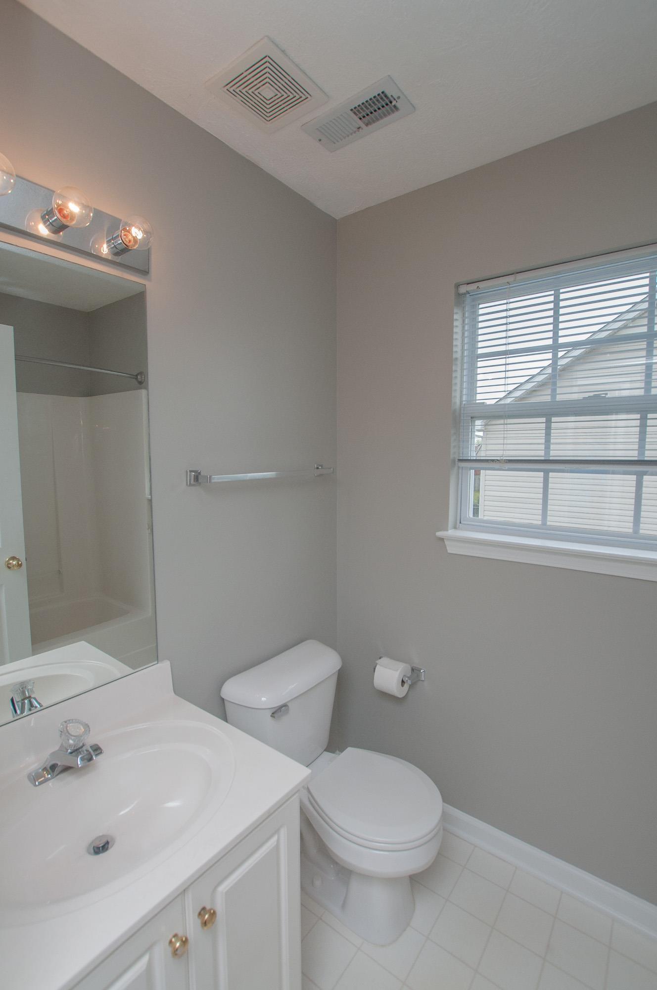 1556 Stone Hill Road Mount Juliet, TN 37122 - Photo 17 of 22 a bathroom with a toilet sink and window