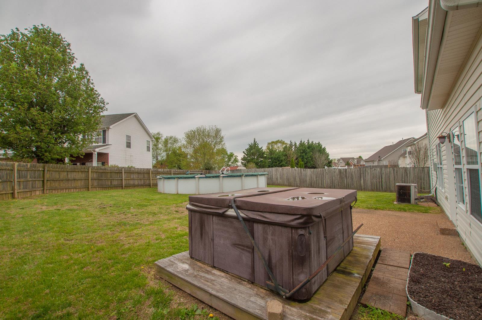 1556 Stone Hill Road Mount Juliet, TN 37122 - Photo 18 of 22 a view of a backyard with sitting area