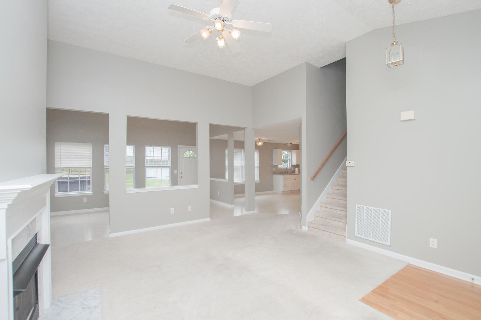1556 Stone Hill Road Mount Juliet, TN 37122 - Photo 8 of 22 a view of an empty room with a fireplace and a window