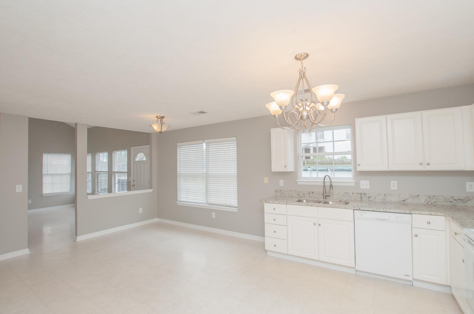 1556 Stone Hill Road Mount Juliet, TN 37122 - Photo 10 of 22 a spacious bathroom with a granite countertop sink a white cabinet and a large mirror