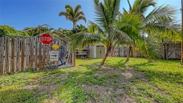 a view of outdoor space with garden and trees