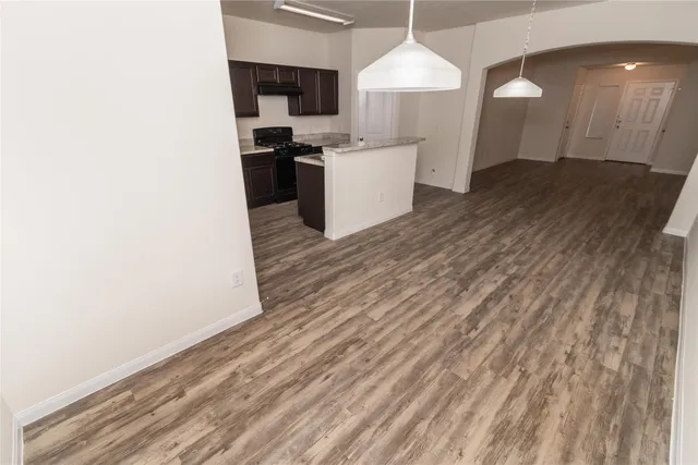 a kitchen with a sink and a stove top oven
