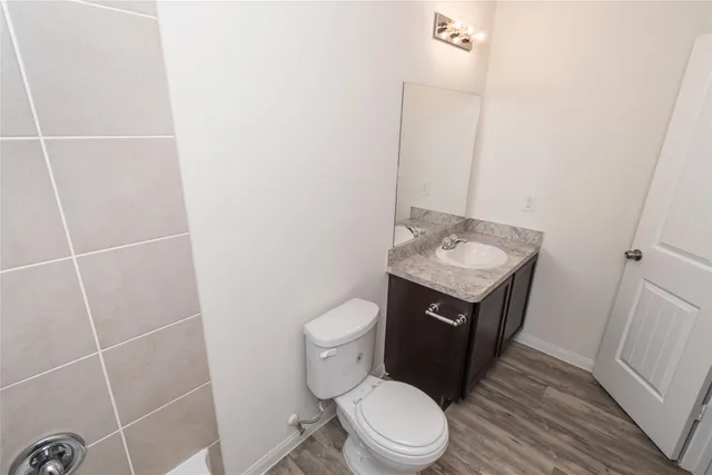 a bathroom with a sink toilet and vanity
