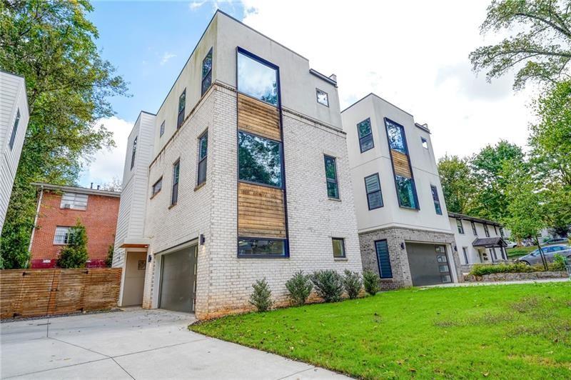 829 Barnett Street Northeast Atlanta, GA 30306 - Photo 2 of 41 a front view of a house with garden