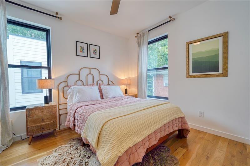 829 Barnett Street Northeast Atlanta, GA 30306 - Photo 23 of 41 a bedroom with a bed and a window
