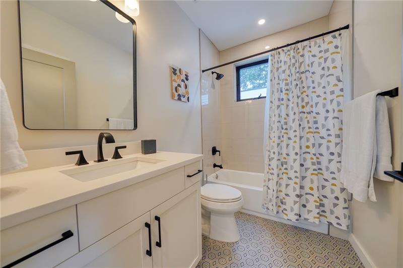 829 Barnett Street Northeast Atlanta, GA 30306 - Photo 26 of 41 a bathroom with a sink toilet and shower