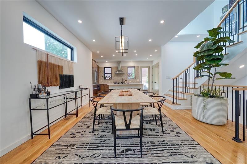 829 Barnett Street Northeast Atlanta, GA 30306 - Photo 10 of 41 a large kitchen with a table and chairs in it