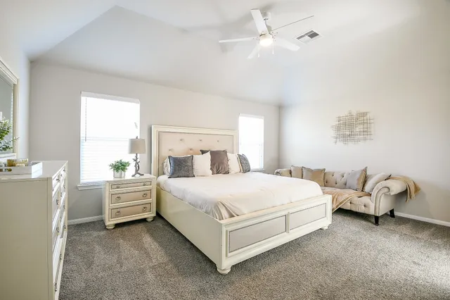 a bed room with a bed and window