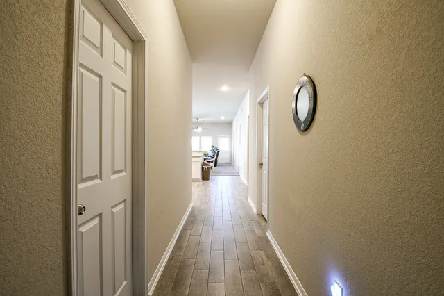 a view of a bathroom from the hallway