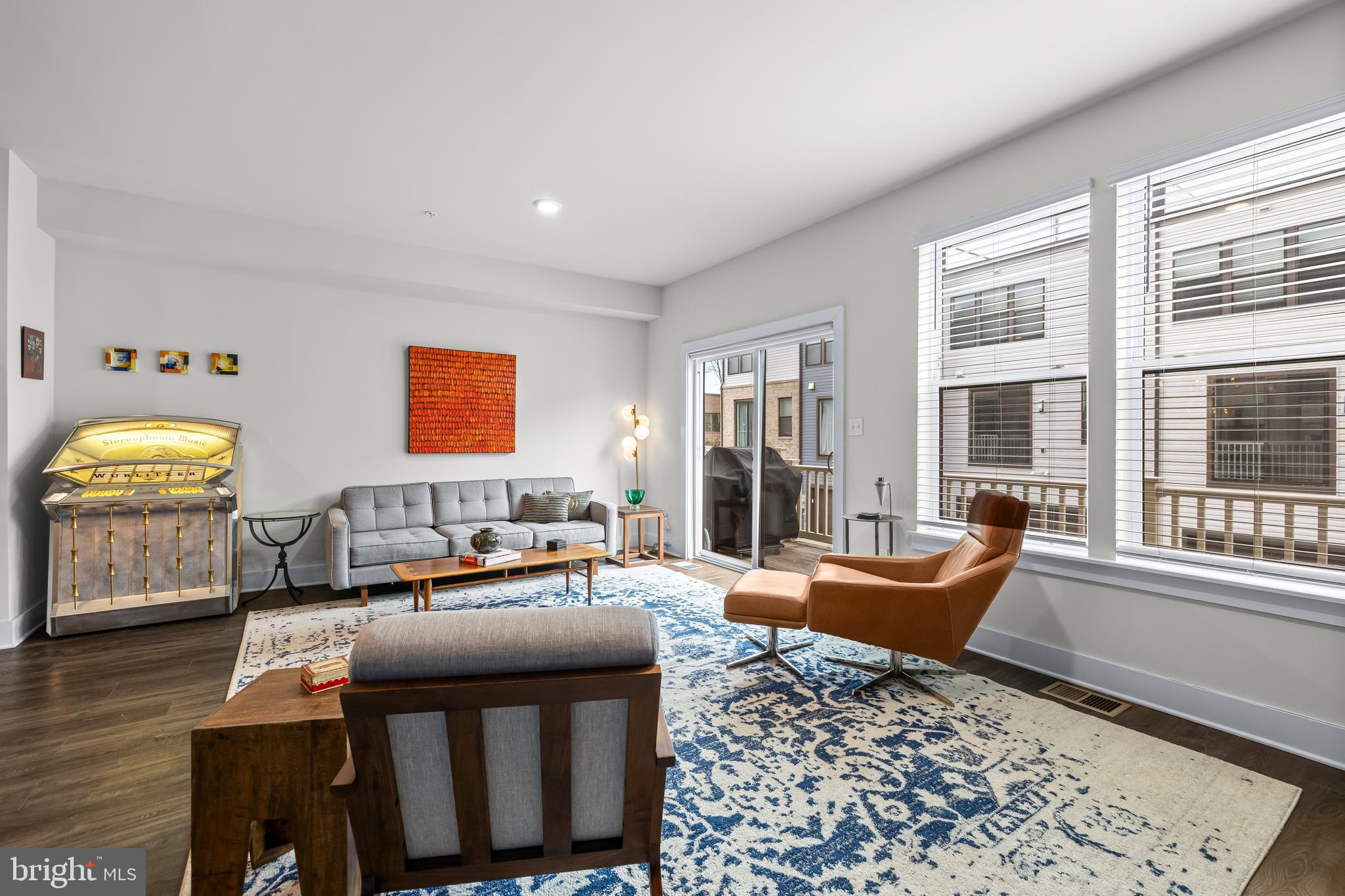 4307 La Plata Avenue Baltimore, MD 21211 - Photo 14 of 54 a living room with furniture and floor to ceiling windows