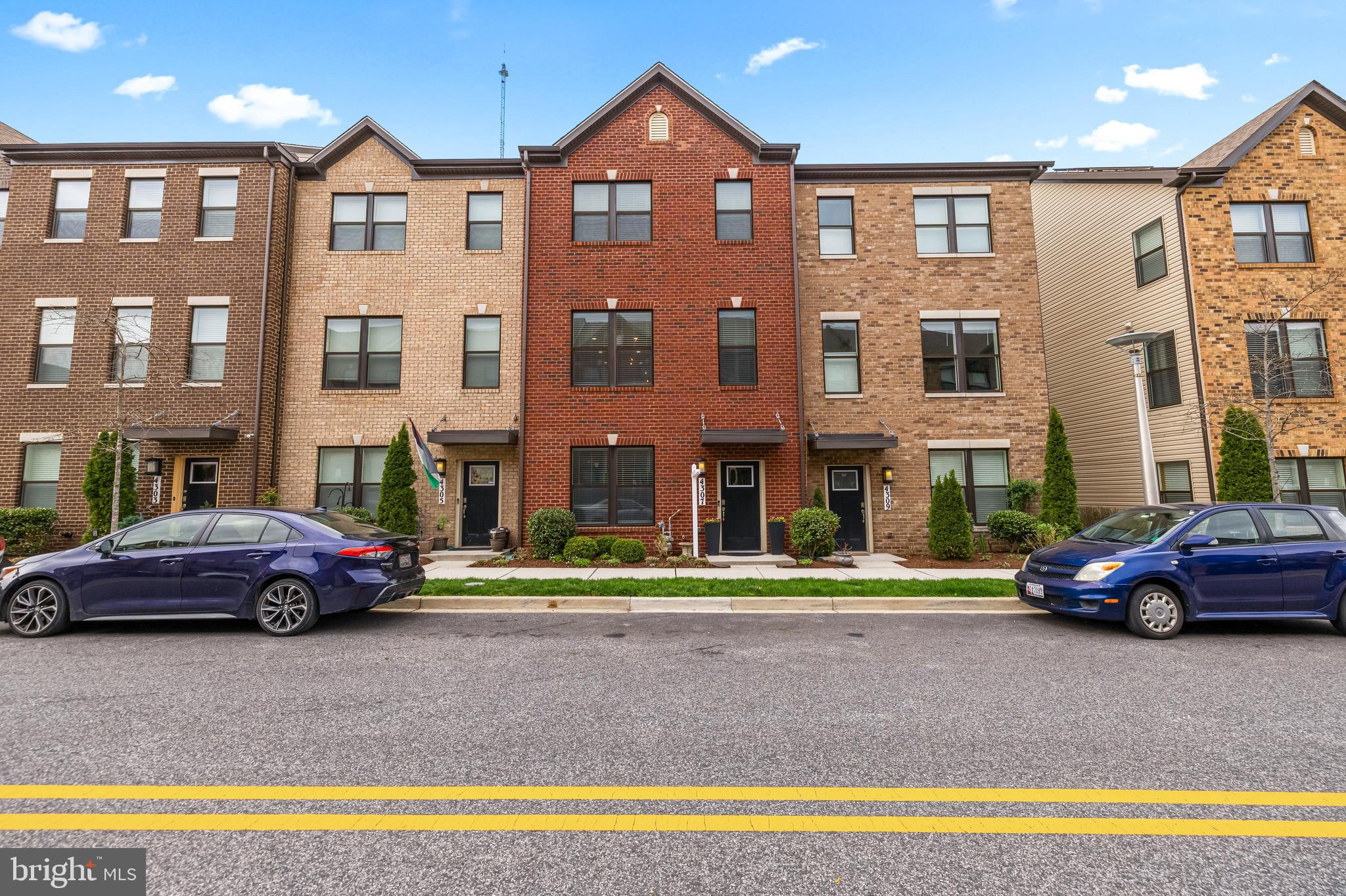 4307 La Plata Avenue Baltimore, MD 21211 - Photo 2 of 54 a front view of a residential apartment building with a yard