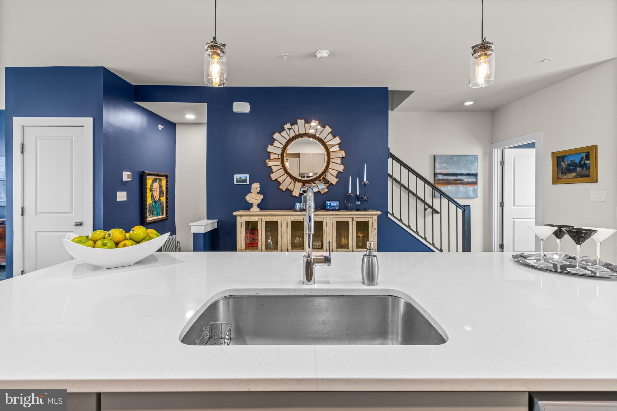 4307 La Plata Avenue Baltimore, MD 21211 - Photo 23 of 54 a kitchen with a sink and a clock