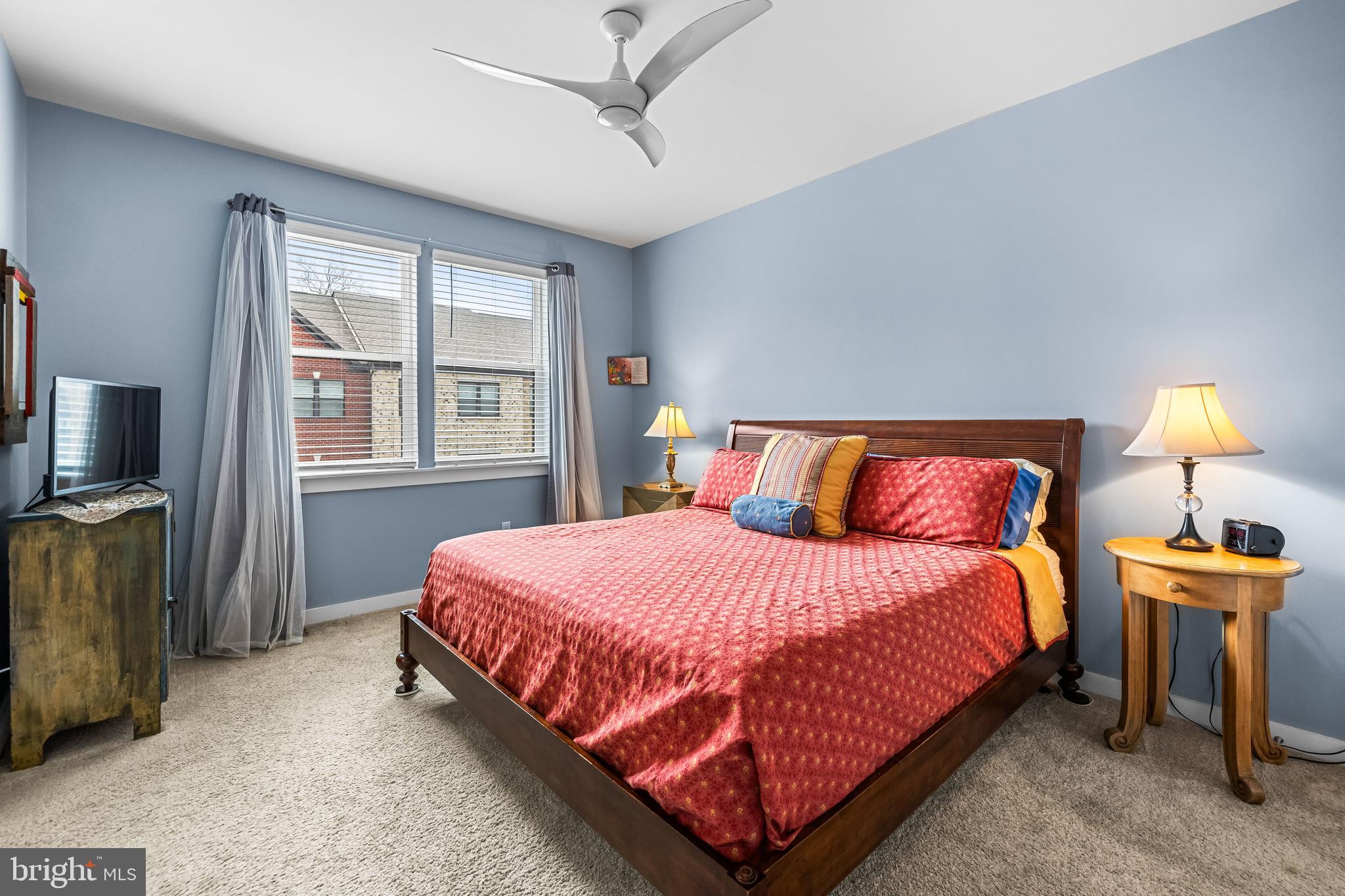 4307 La Plata Avenue Baltimore, MD 21211 - Photo 35 of 54 a bedroom with a bed and a tv on a dresser