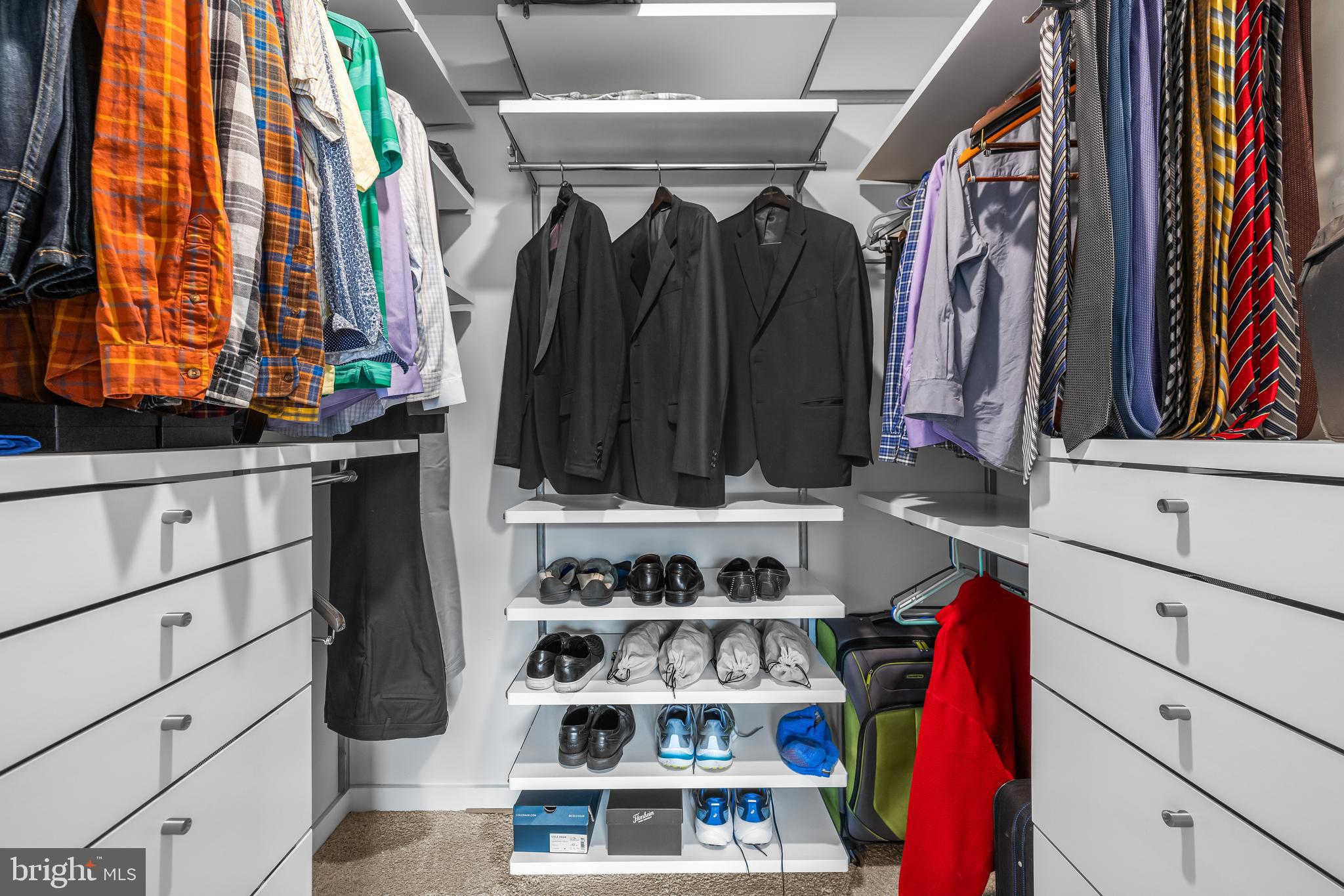 4307 La Plata Avenue Baltimore, MD 21211 - Photo 38 of 54 a view of walk in closet with clothes and shoes