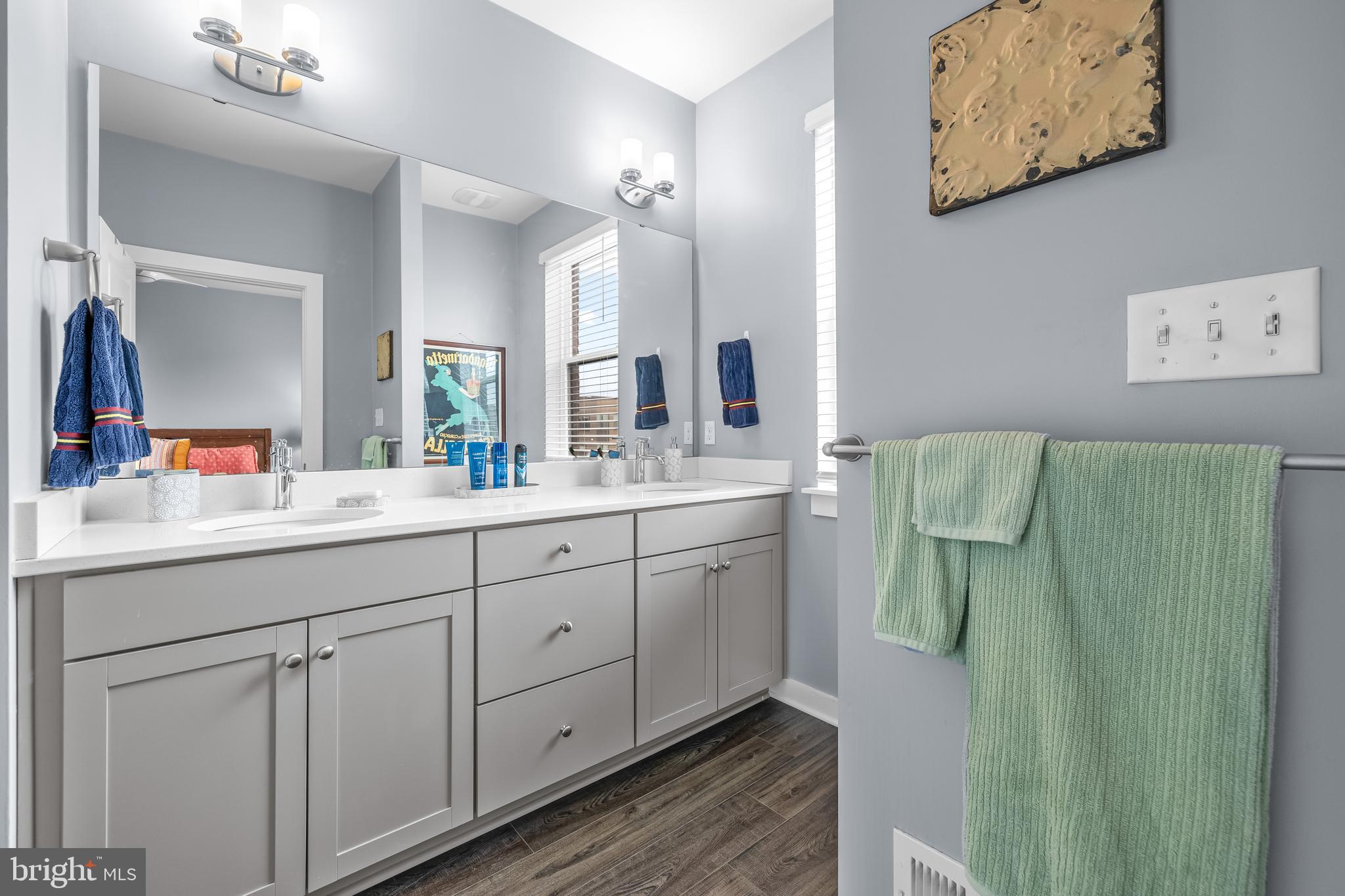 4307 La Plata Avenue Baltimore, MD 21211 - Photo 39 of 54 a spacious bathroom with a double vanity sink mirror and