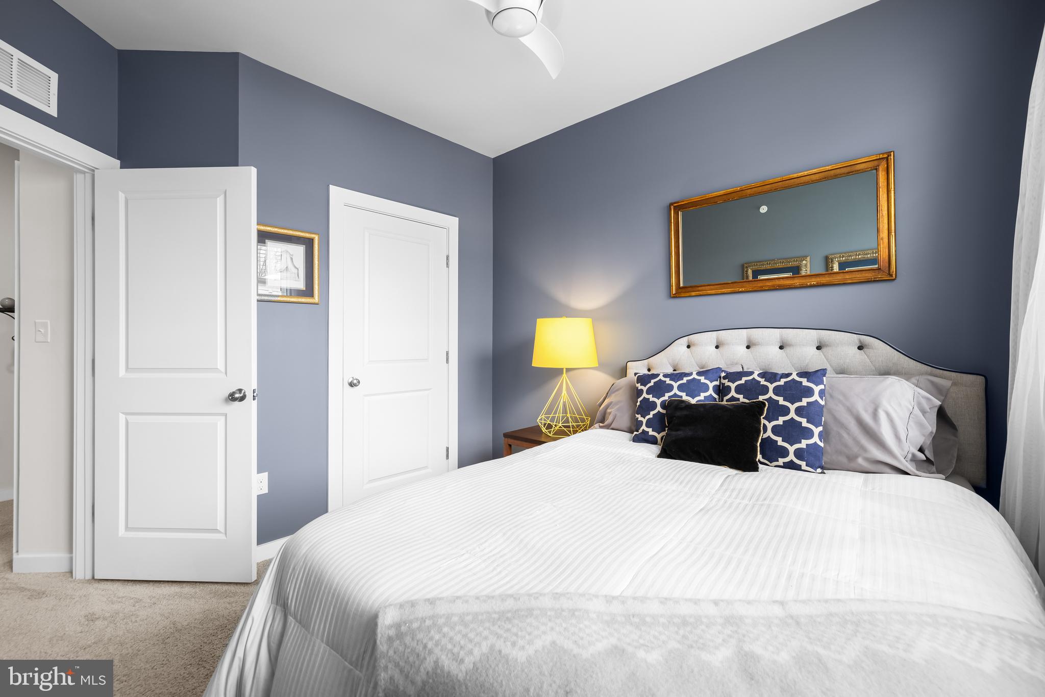 4307 La Plata Avenue Baltimore, MD 21211 - Photo 42 of 54 a bedroom with a bed and a painting on the wall