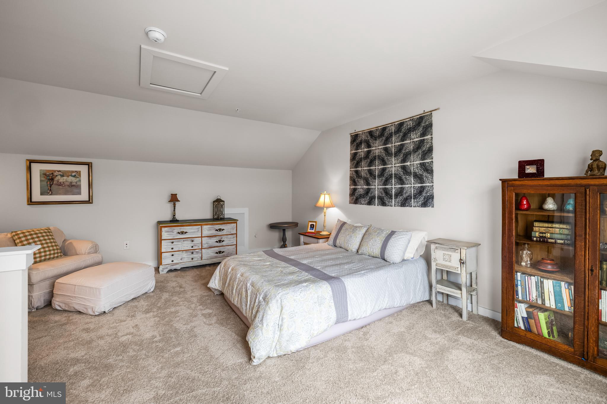 4307 La Plata Avenue Baltimore, MD 21211 - Photo 47 of 54 a spacious bedroom with a bed and dresser