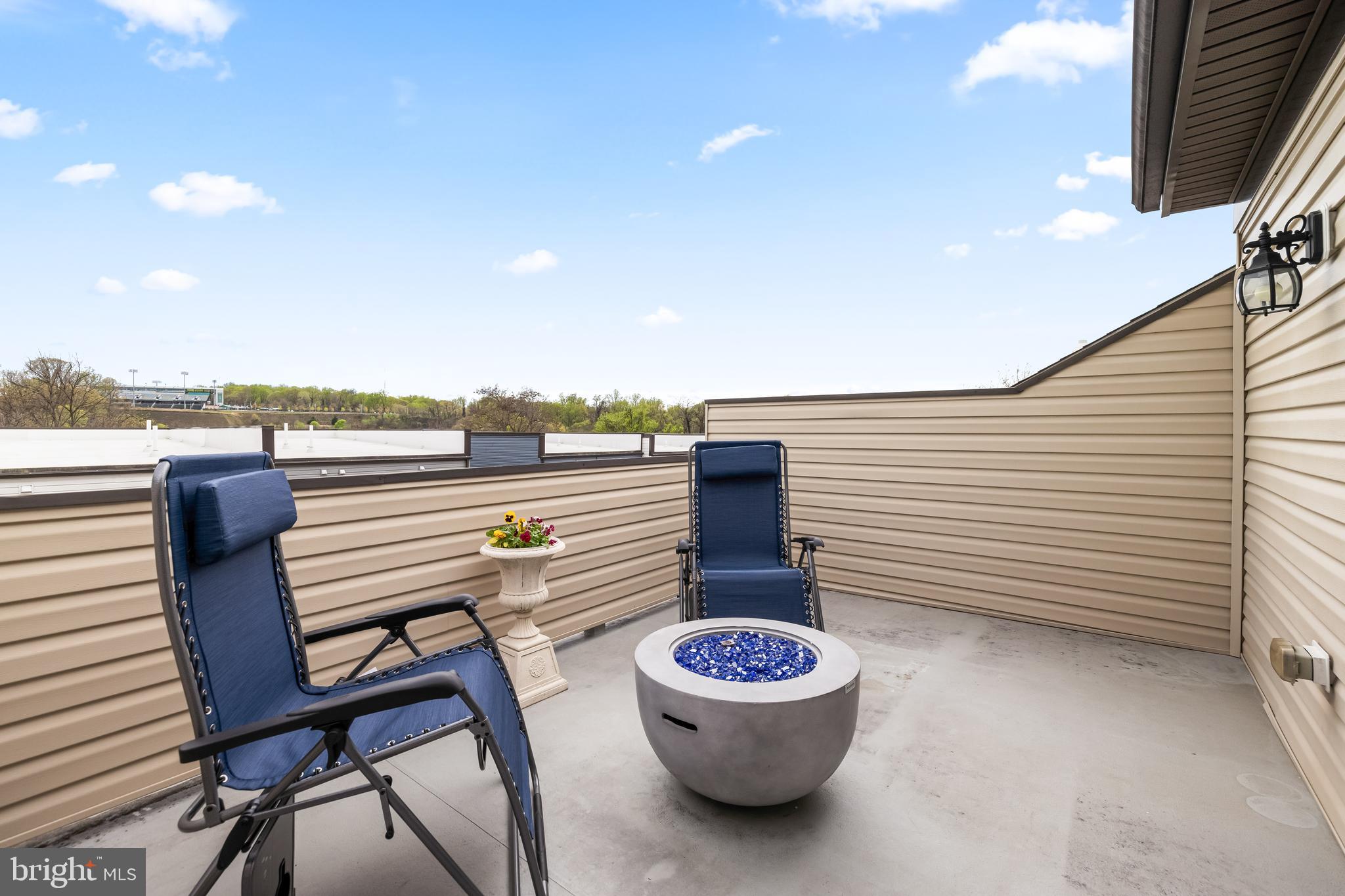 4307 La Plata Avenue Baltimore, MD 21211 - Photo 49 of 54 a view of a terrace with furniture and stove