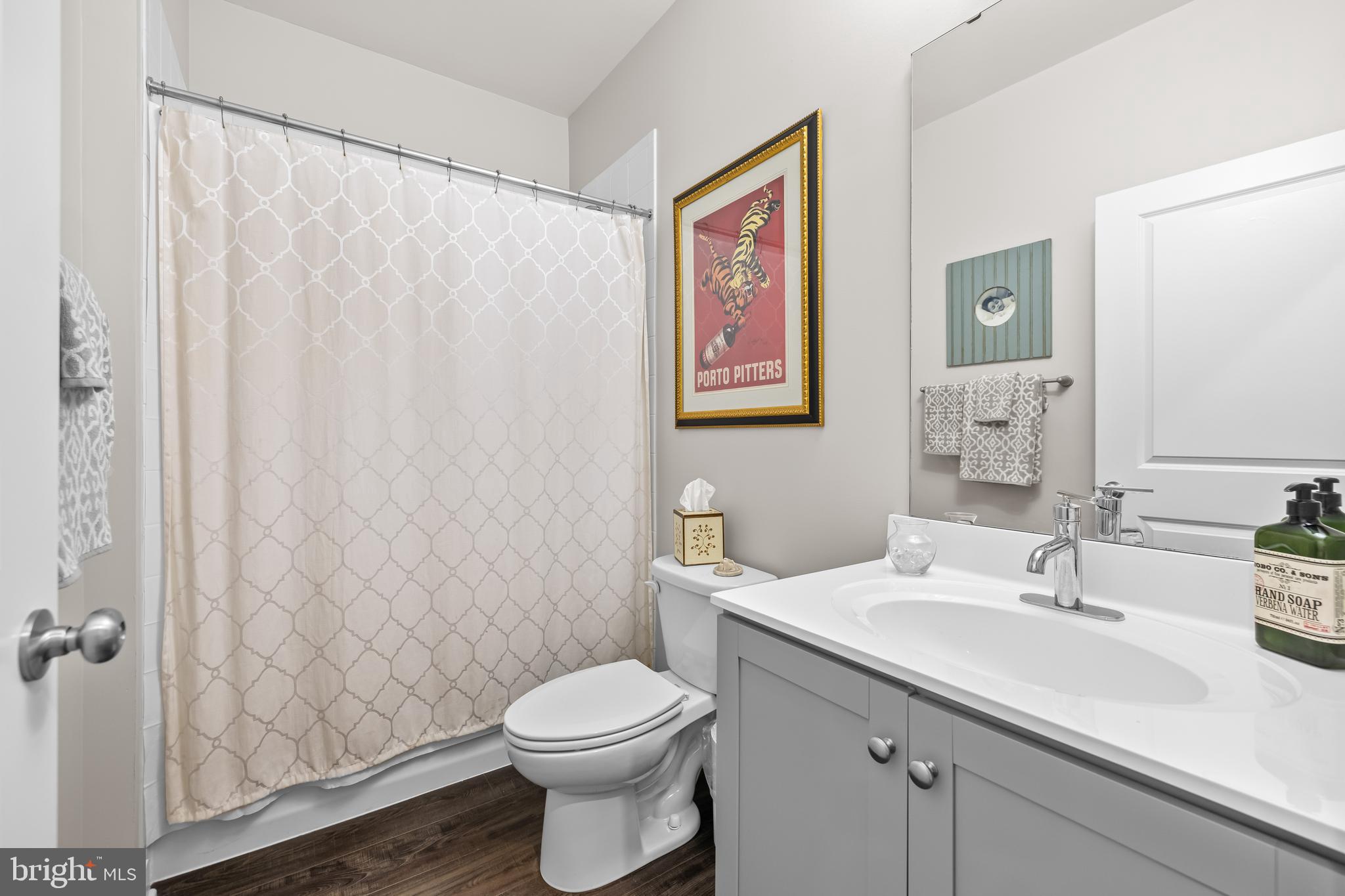 4307 La Plata Avenue Baltimore, MD 21211 - Photo 10 of 54 a view of bathroom with a sink mirror and toilet