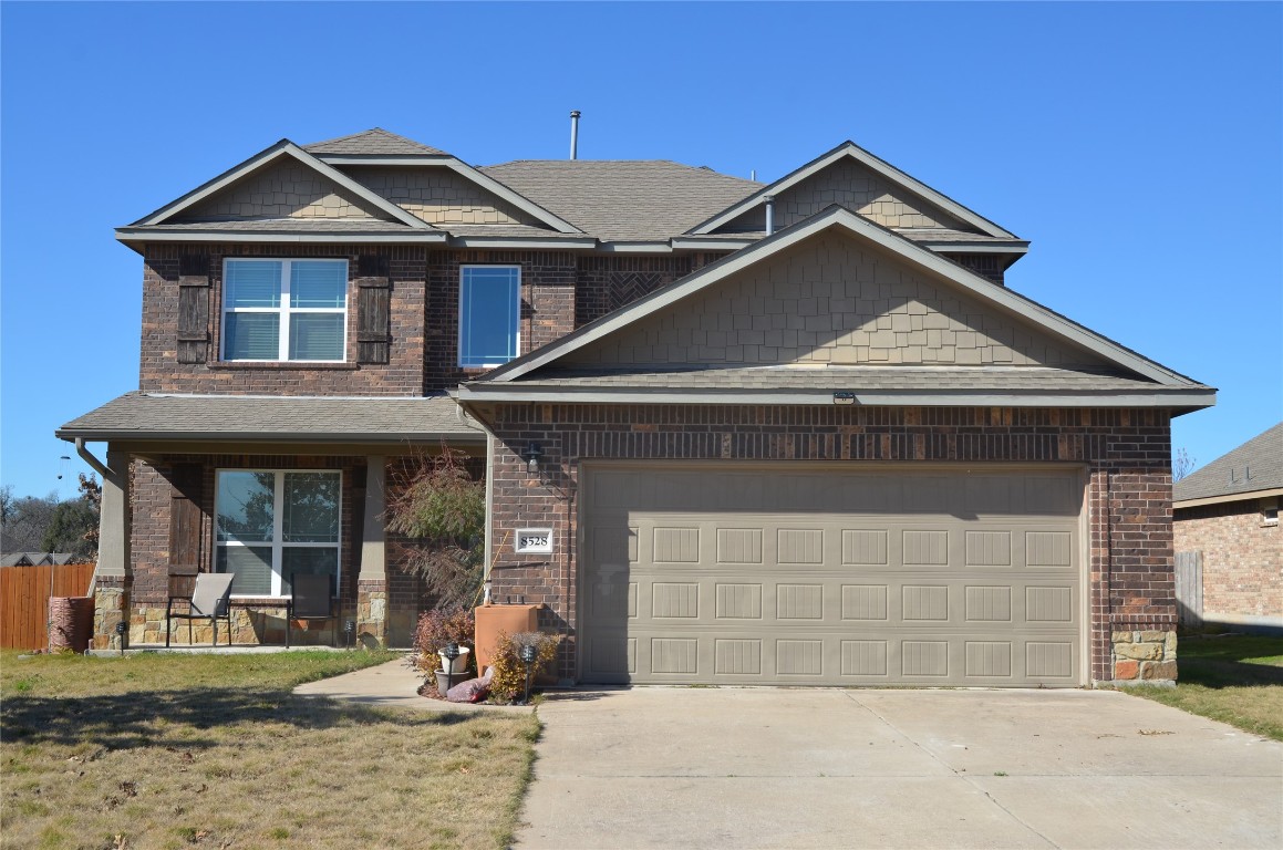8528 Reggio Street Round Rock, TX 78665 - Photo 1 of 27 a front view of a house with garden