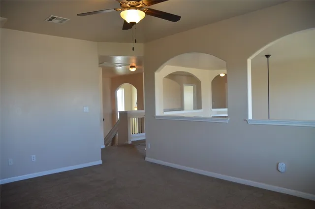 a view of a livingroom with a staircase